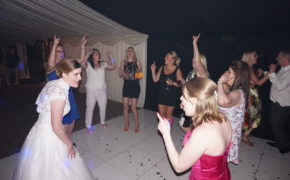 Bride on the dance floor with guests